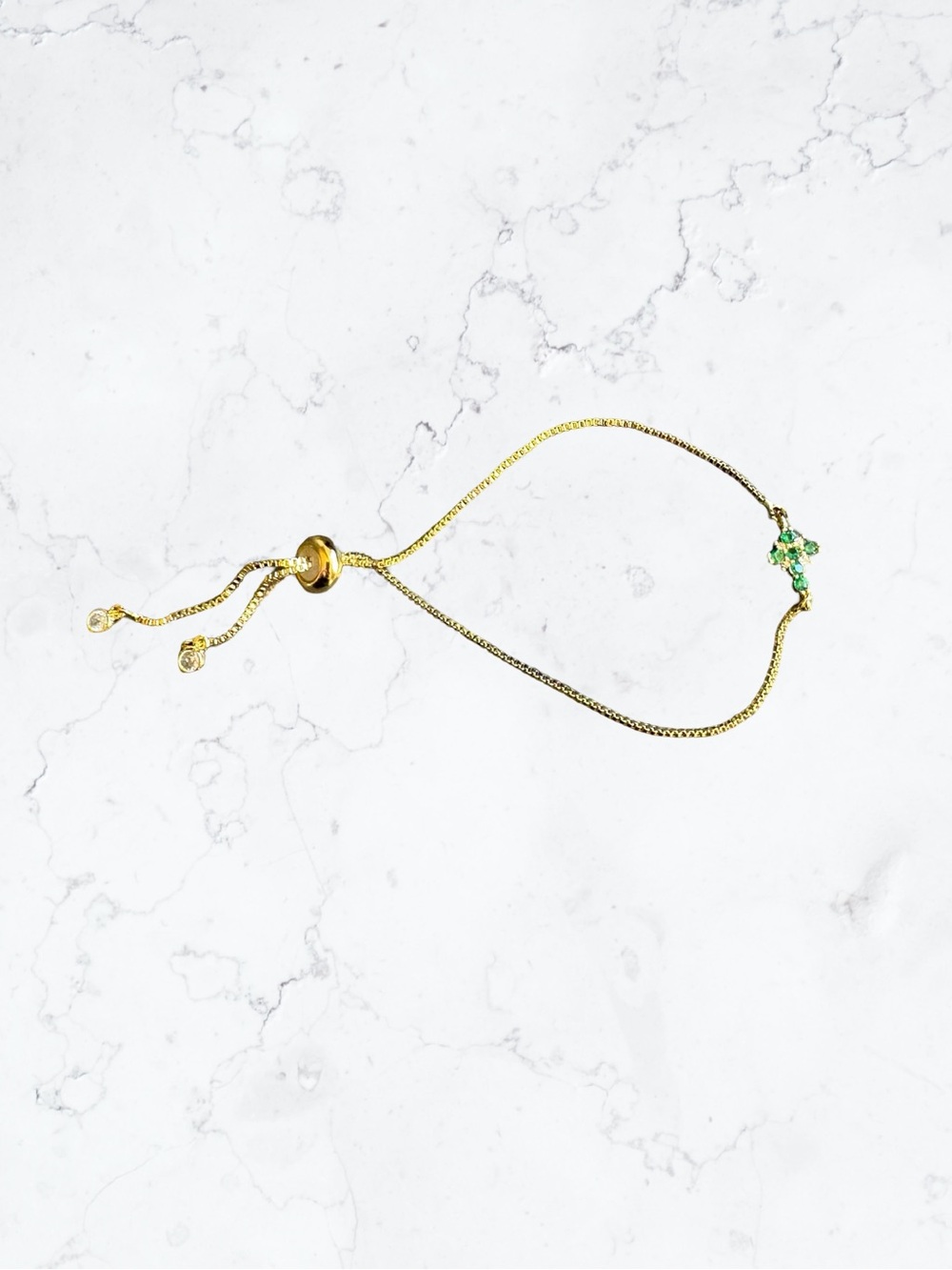 Gold-Tone Adjustable Bracelet with Green Crystal Cross